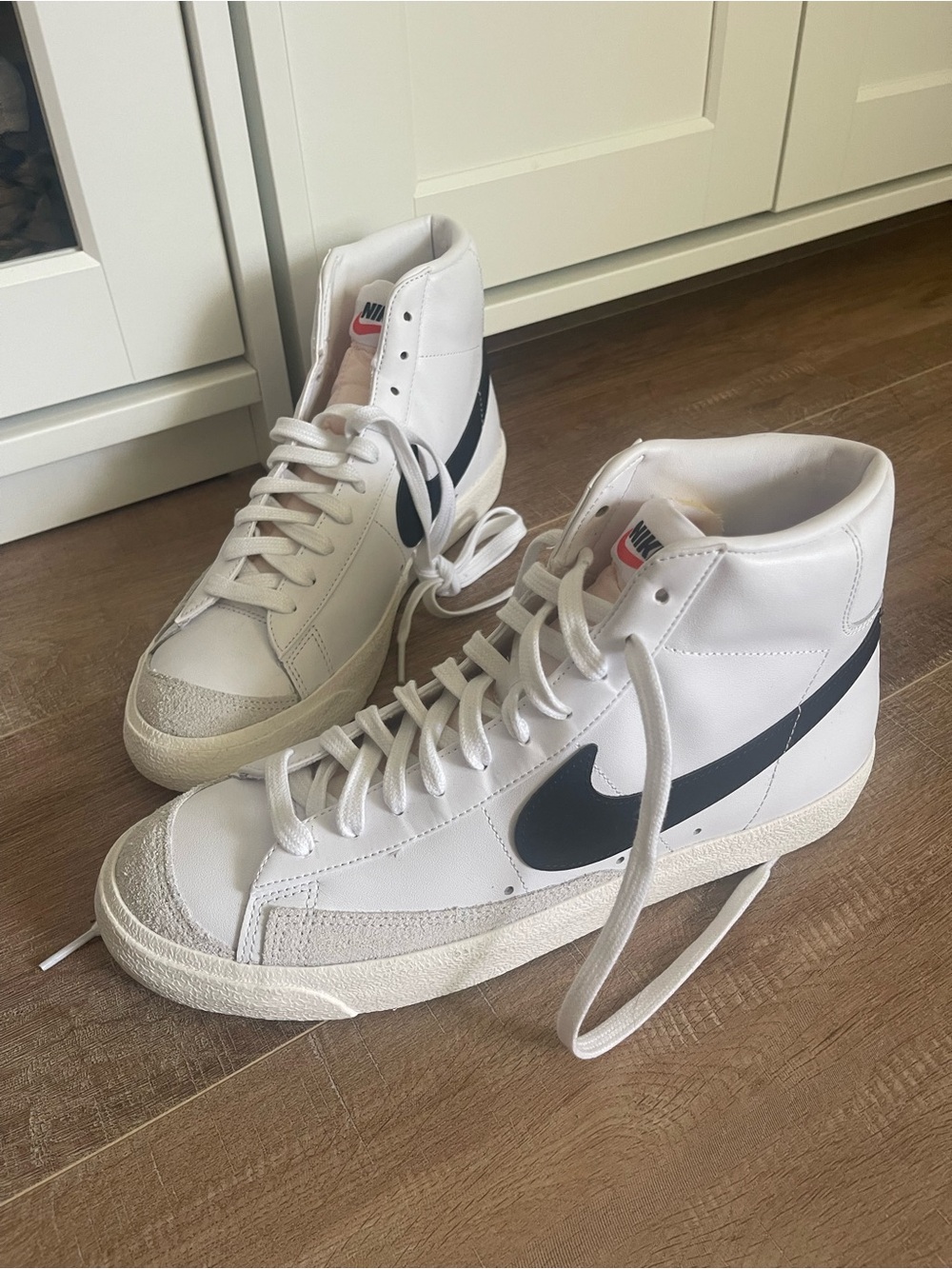 Nike White High-Top Sneakers with black Swoosh